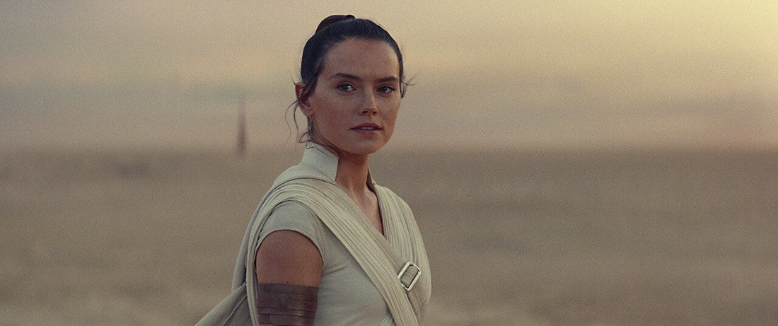 Rey standing in the Tatooine desert at sunset in Star Wars: The Rise of Skywalker