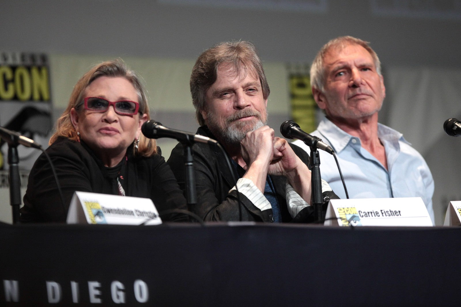 Carrie Fisher, Mark Hamill and Harrison Ford seated together at a San Diego Comic-Con panel in 2015