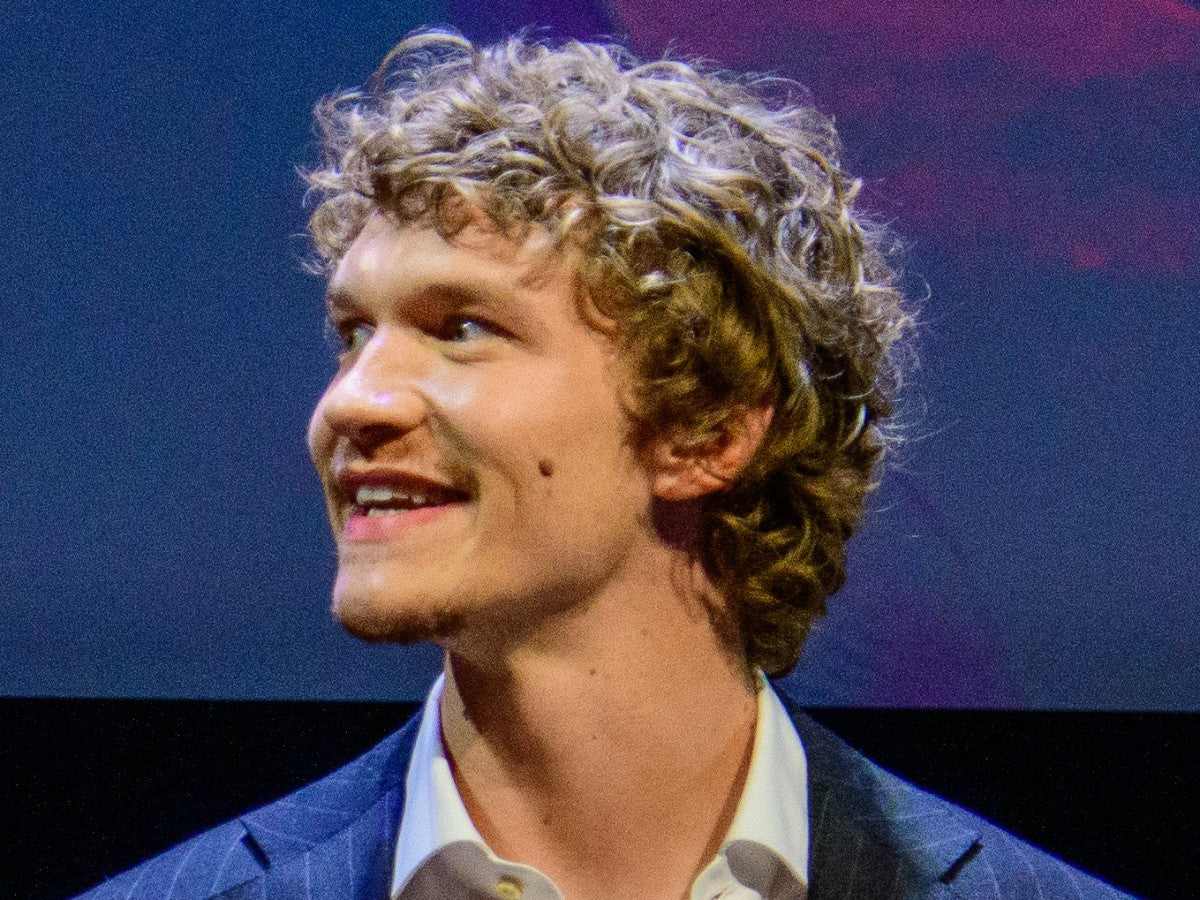 Connor Storrie smiling in a portrait photo