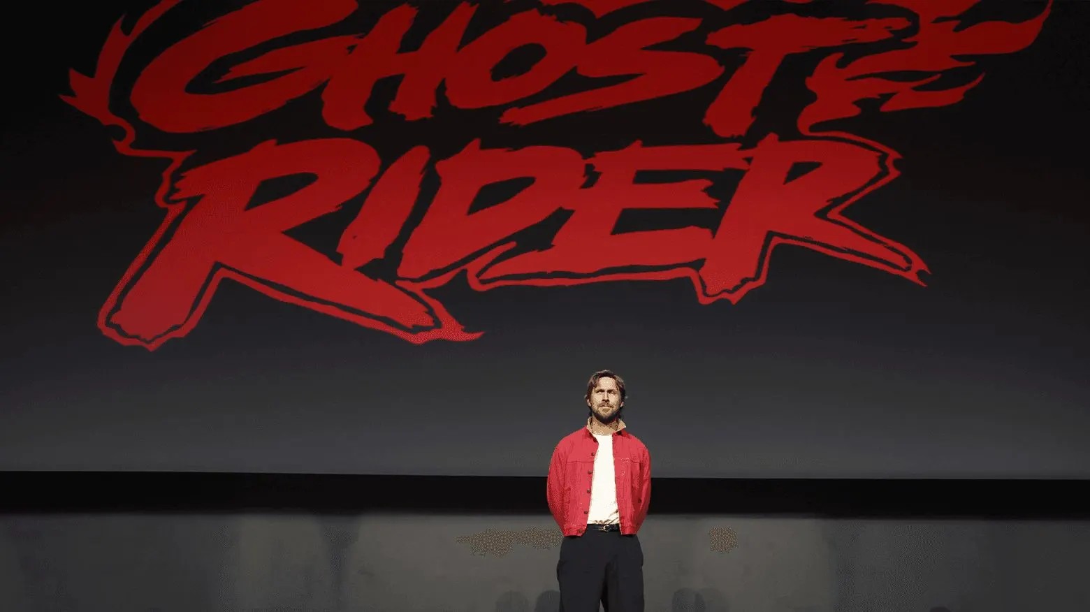 Ryan Gosling standing under the Ghost Rider logo in Hall H at San Diego Comic-Con 2026