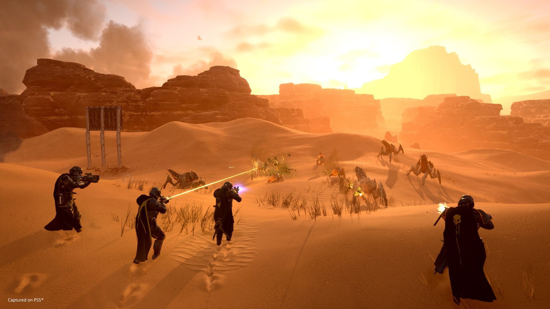A squad of Helldivers fights off enemies in Helldivers 2