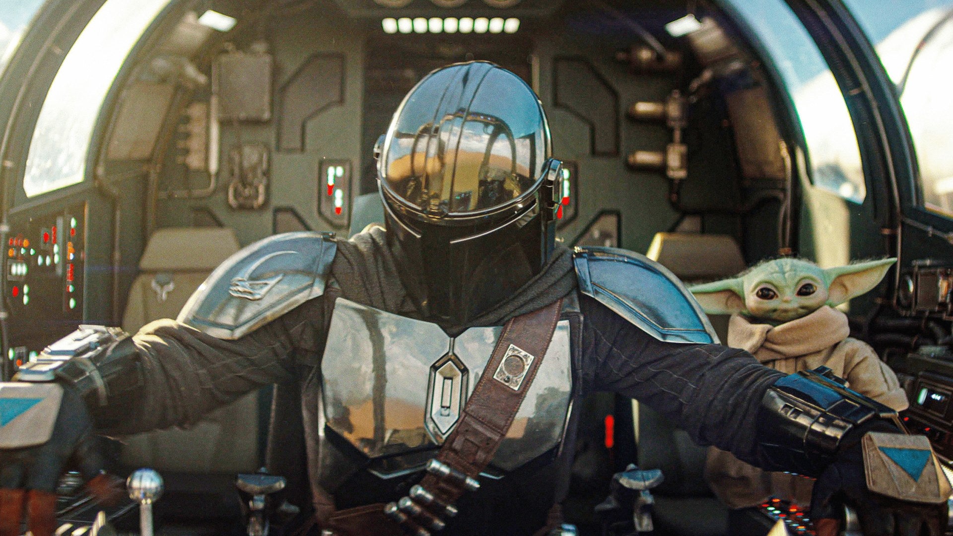 Din Djarin and Grogu sit in a starship cockpit in The Mandalorian and Grogu