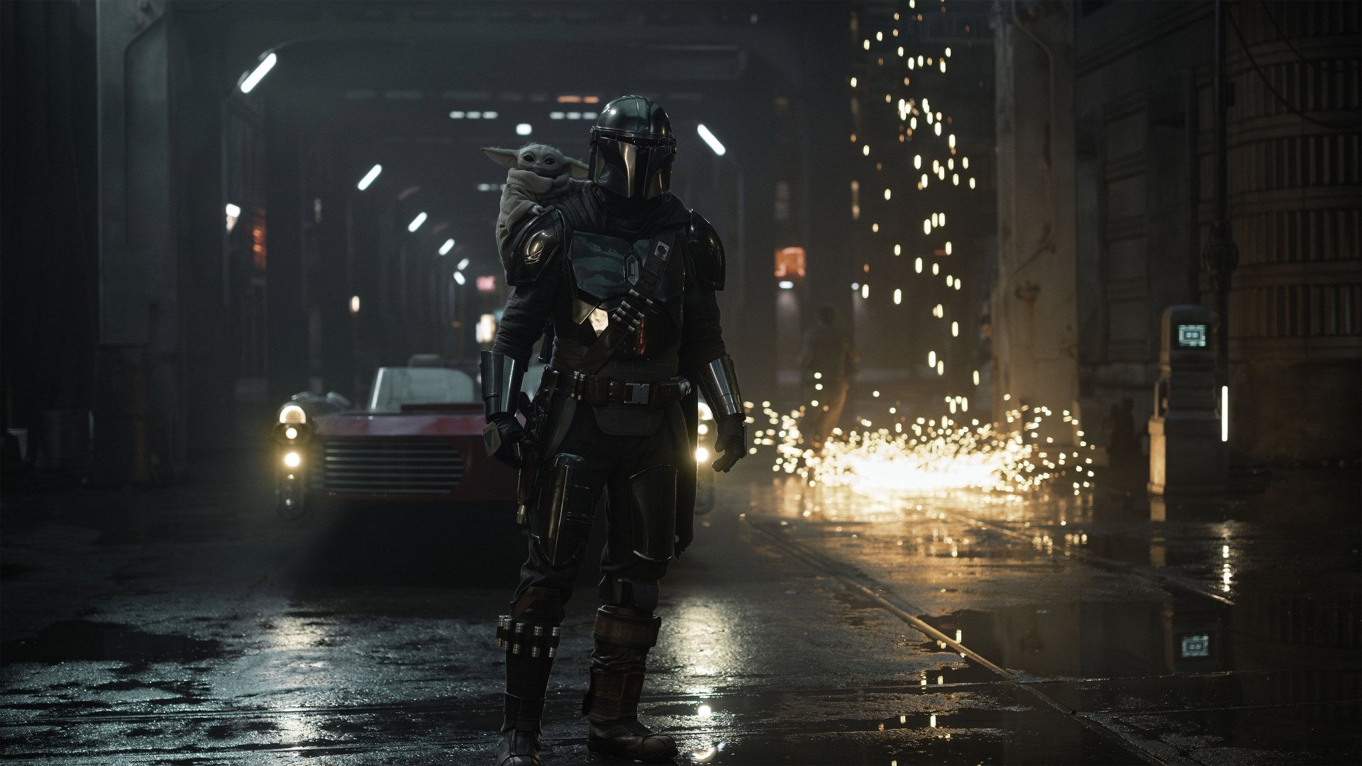 Din Djarin walks down a rainy city street at night in The Mandalorian and Grogu