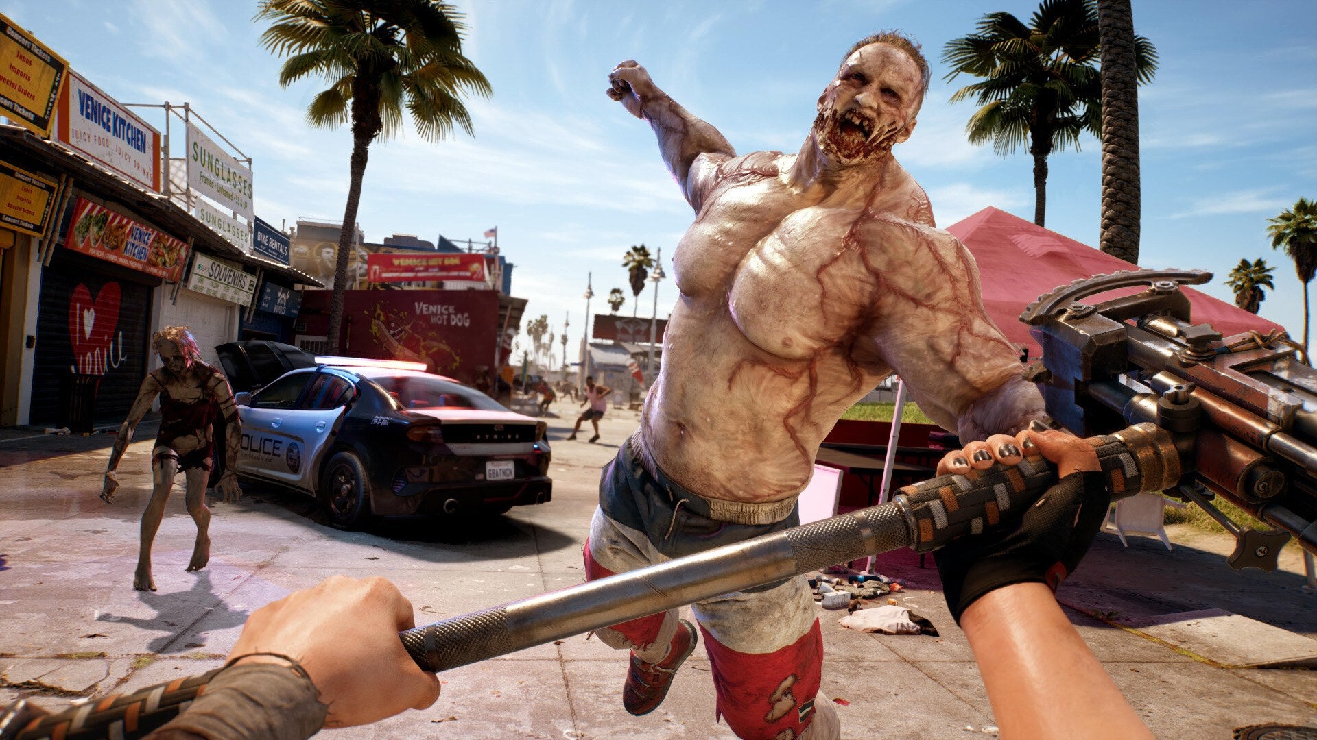 A survivor fights zombies on a sunny Los Angeles street in Dead Island 2