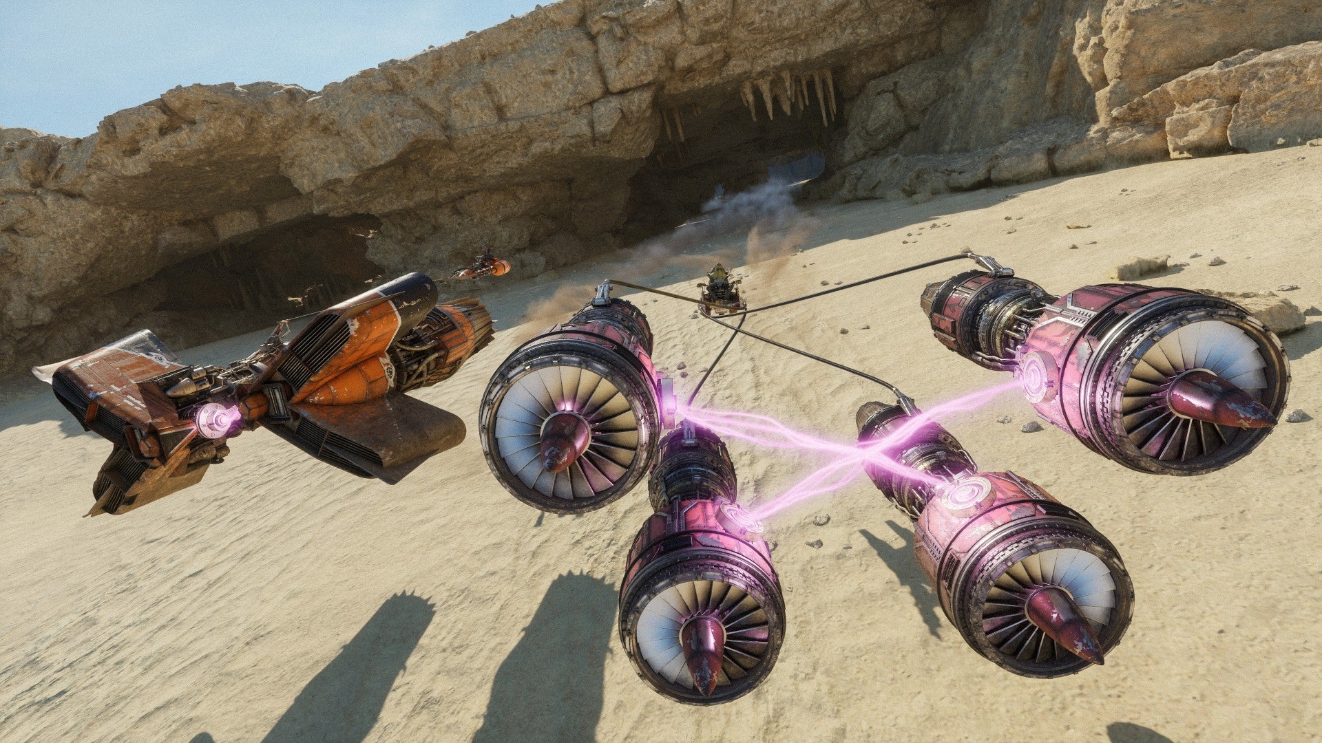 Two podracers with glowing pink energy binders racing across a sandy track near a rock arch